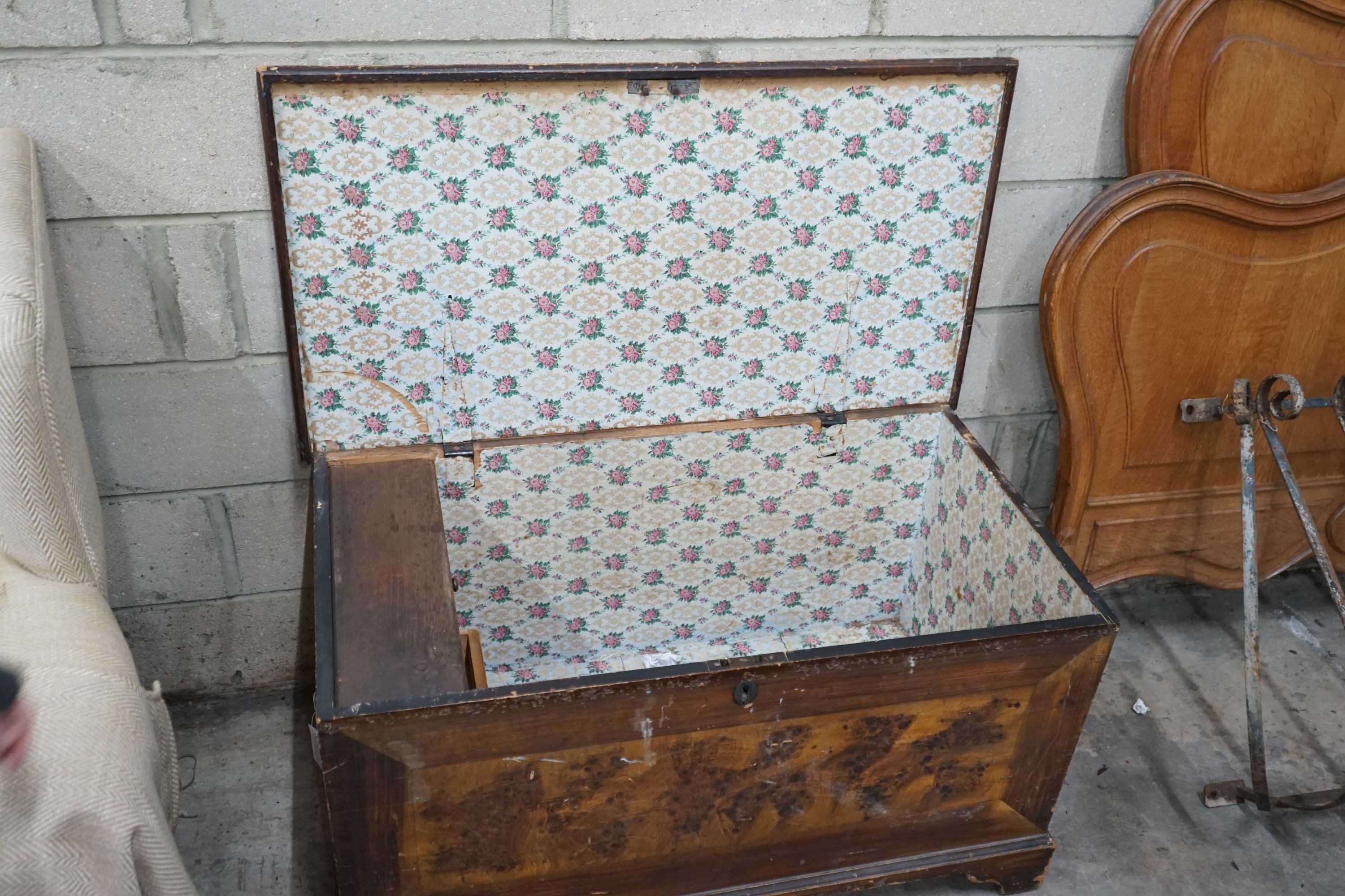 A Victorian pine trunk with simulated painted grain, width 108cm, depth 58cm, height 60cm